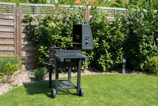 istock Grill with prepared charcoal for grilling outdoors on backyard 1158141914