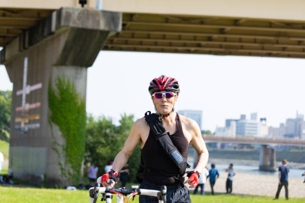 Cyclist pushing racing bike