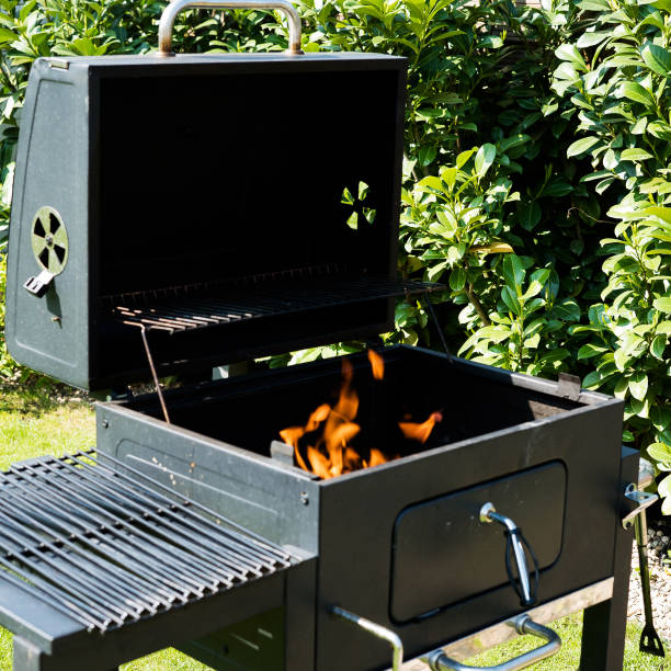 istock Grill with prepared charcoal for grilling outdoors on backyard 1158144877