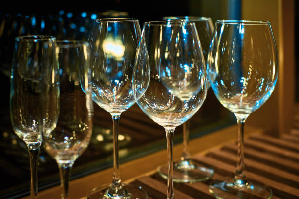 istock empty wine glasses on wooden plank stand illuminated with a pleasant soft light 1158146781