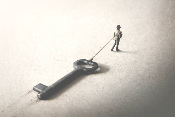 istock man dragging a big heavy key, access surreal concept 1158148740