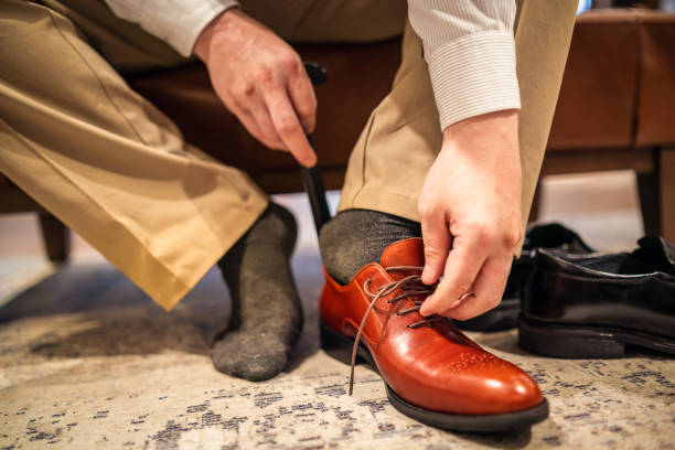 istock Trying on a new leather shoe 1158154506
