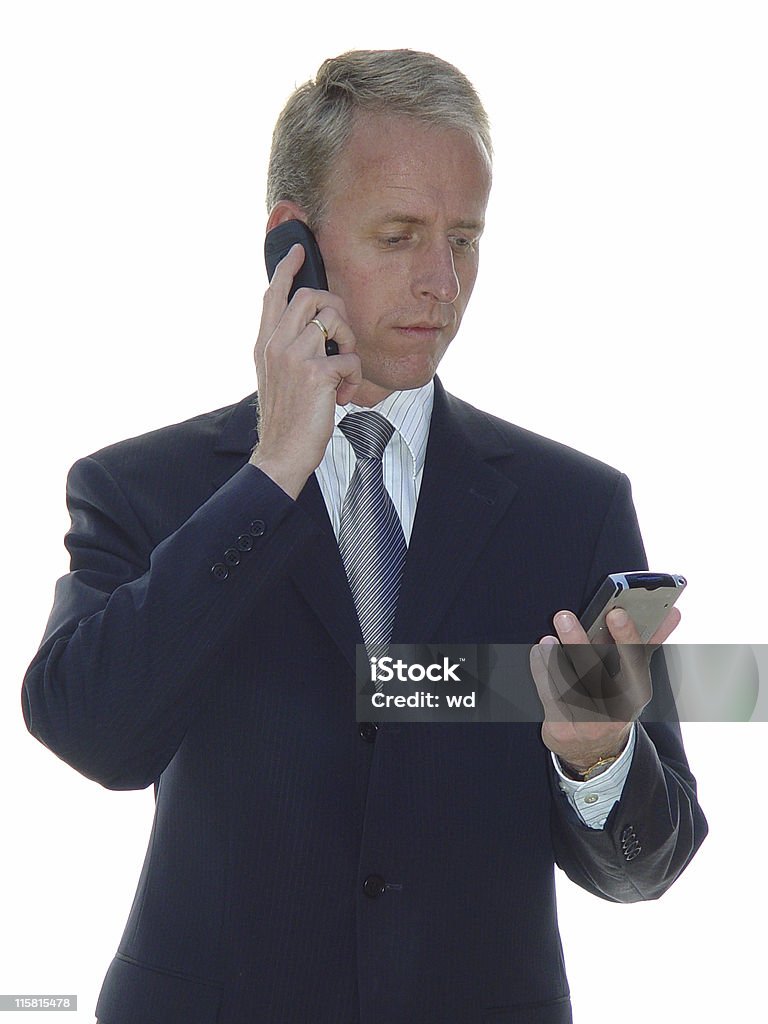Un hombre de negocios con teléfono y pda - Foto de stock de Adulto libre de derechos