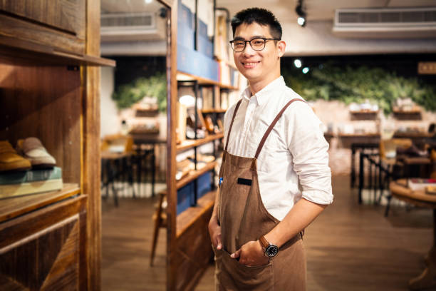 istock Salesman in a shoe store 1158156670