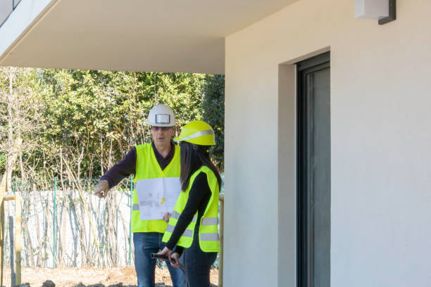 istock Man and woman, construction worker on a construction site visit 1158156877