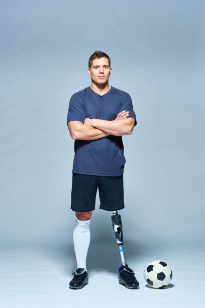 istock Confident football player with artificial leg 1158157756