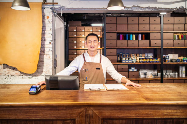 istock Asian shoe store owner 1158158383