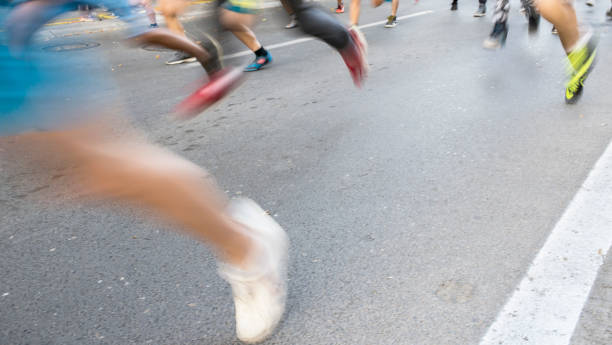 istock Blur, marathon running race, young people running 1158158620