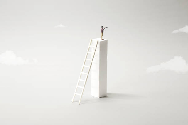 istock business man on the top watching the future with binocular 1158159347