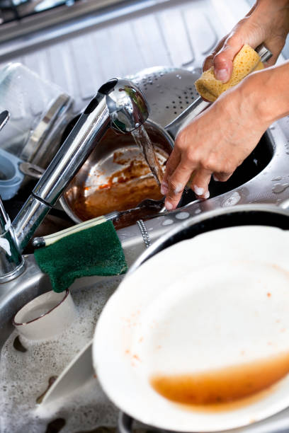 istock wash the dishes 1158159741