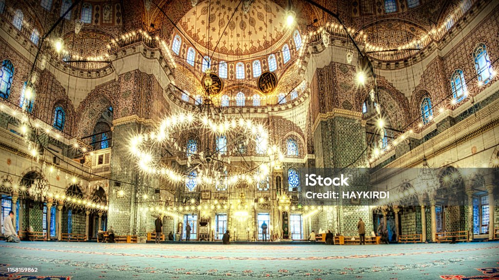 New mosque eminonu Istanbul Turkey Muslims in prayer in the new mosque eminonu / Istanbul Turkey Salah - Islamic Prayer Stock Photo