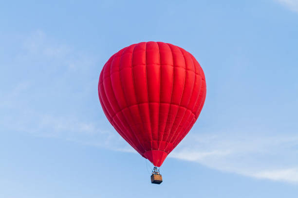istock red air balloon flies across the blue sky 1158162602