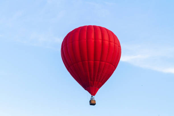 istock (aeronautics) Balloon flies across the blue sky 1158162605