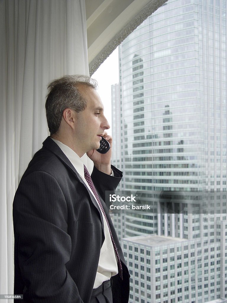 Empresario junto a la ventana - Foto de stock de Acuerdo libre de derechos