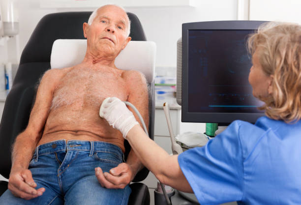 istock Female technician diagnosing male patient using modern ultrasound scanner in private clinic 1158172221