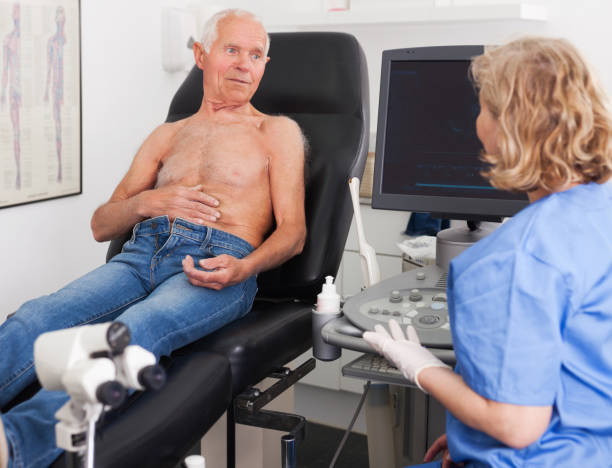 istock doctor examines a senior man  with ultrasonic  device 1158172227