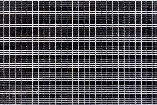 Metal tile grid texture. Steel pavement background. Abstract metal flooring pattern. Floor grilles ventilation backdrop