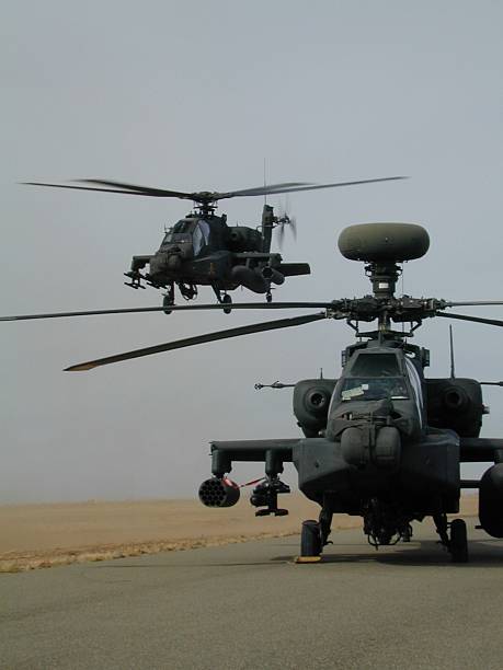 Helicopter Attack U.S. military attack helicopter, the Apache AH-64D Longbow. 20mm machine gun stock pictures, royalty-free photos & images