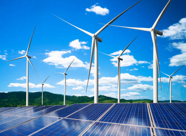 istock Solar panel and wind turbine farm clean energy. 1158175310
