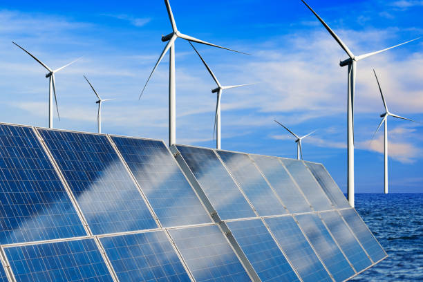 istock Solar panel and wind turbine farm clean energy. 1158175337