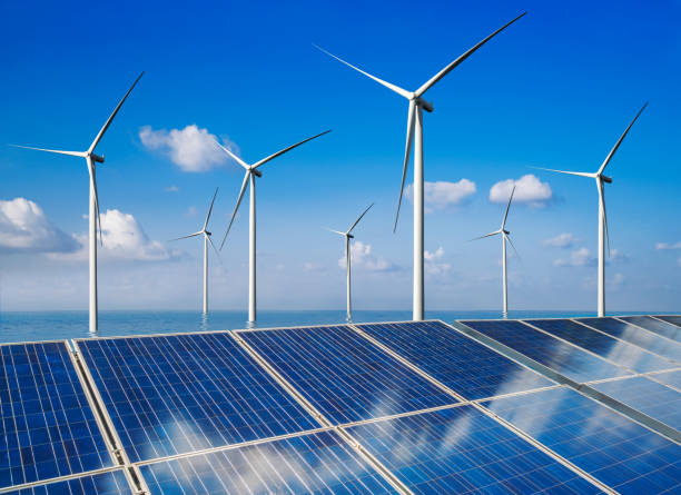 istock Solar panel and wind turbine farm clean energy. 1158175339