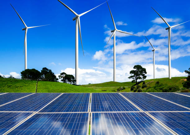 istock Solar panel and wind turbine farm clean energy. 1158175358
