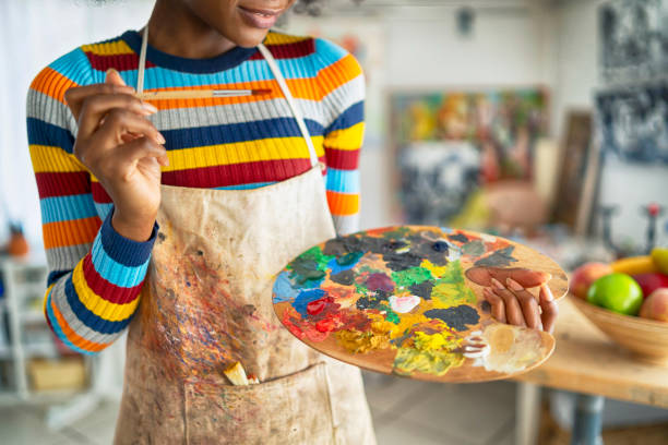 istock Female artist working in studio 1158180646