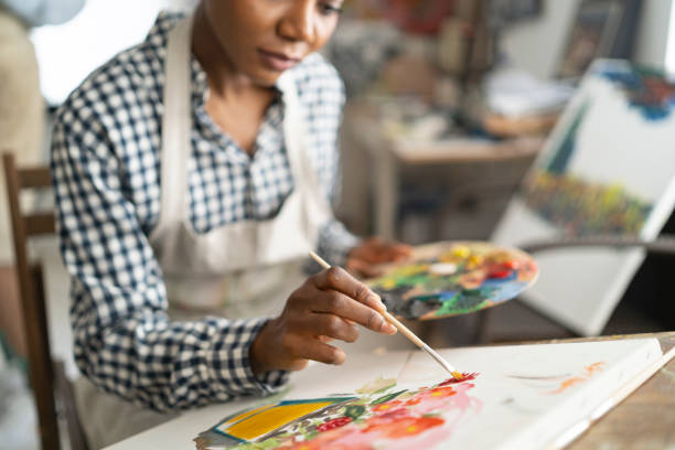 istock Female artist working in studio 1158180652