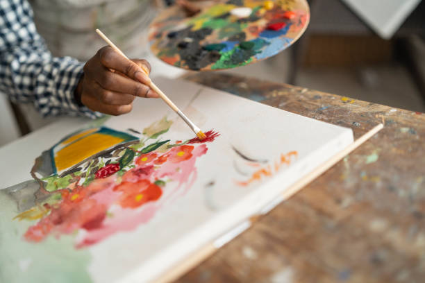 istock Female artist working in studio 1158180663