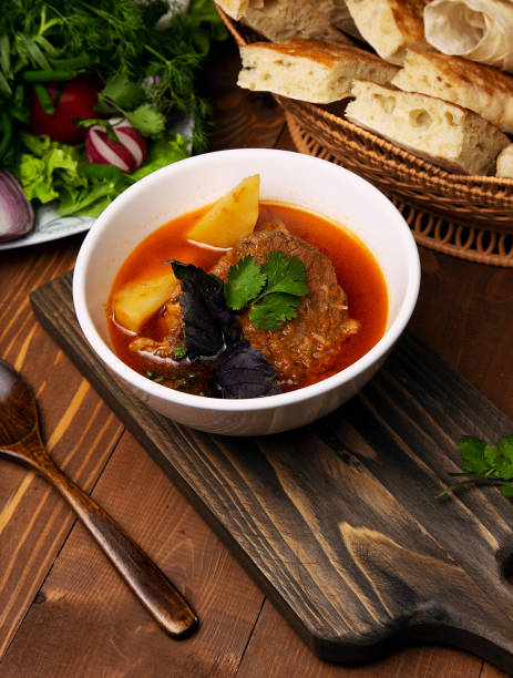 istock Beef, lamb stew, bosbash soup with potatoes, basilic and parsley in tomato sauce. 1158180767