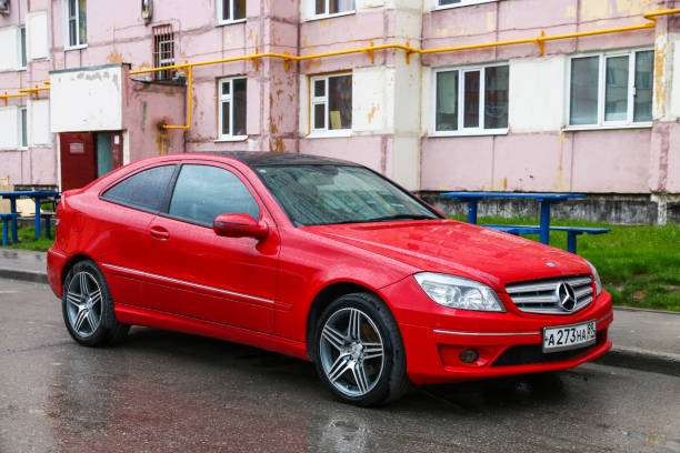 Novyy Urengoy, Russia - June 21, 2019: Red motor car Mercedes-Benz CL203 CLC-class in the city street.
