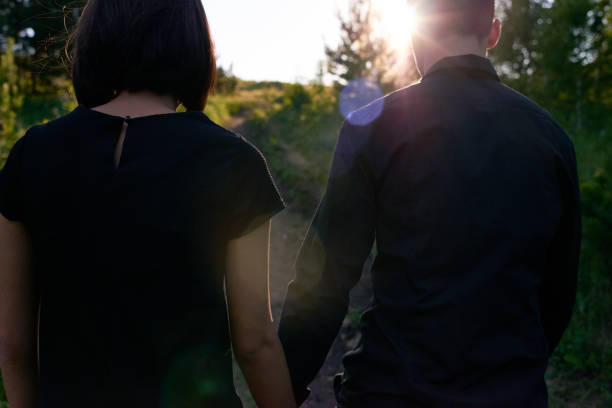 istock Anonymous couple walking in countryside 1158183341