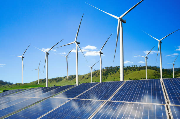 istock Solar panel and wind turbine farm clean energy. 1158183427