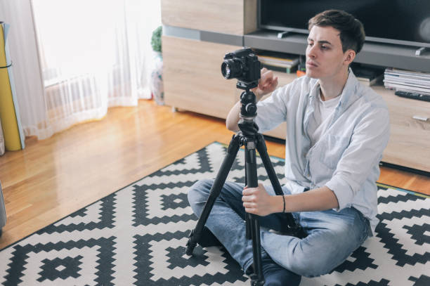 istock Young male vlogger adjusting his gear 1158183640