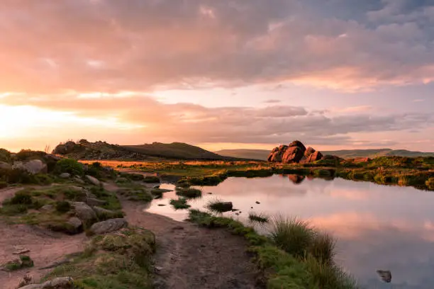 Sunset reflections on Doxey Pool at The Roaches, in the Peak District National Park, Staffordshire.