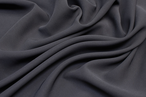 Fabric viscose (rayon). Color is gray. Texture, background, pattern.