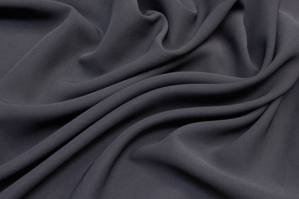 Fabric viscose (rayon). Color is gray. Texture, background, pattern. Fabric viscose (rayon). Color is gray. Texture, background, pattern. viscose stock pictures, royalty-free photos & images