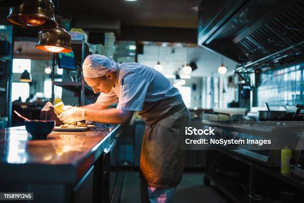 Chef Serving Food Stock Photo - Download Image Now - Chef, Restaurant, Kitchen