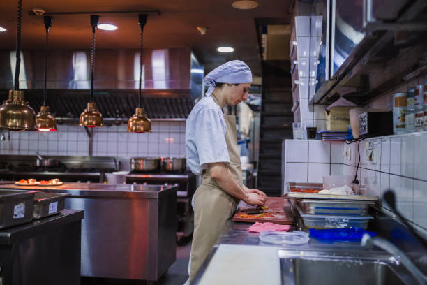 istock Chef cooking in the modern kitchen in a high-end restaurant 1158191257