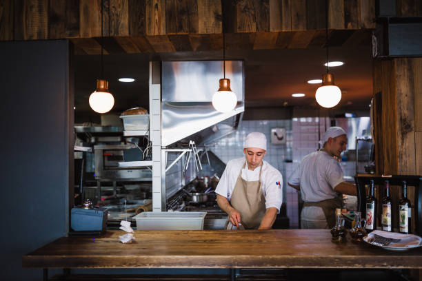 istock Chef cooking in the modern kitchen in a high-end restaurant 1158191259