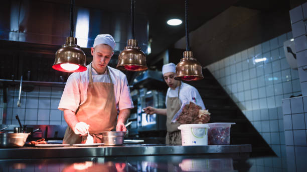 istock Chef cooking in the modern kitchen in a high-end restaurant 1158191289