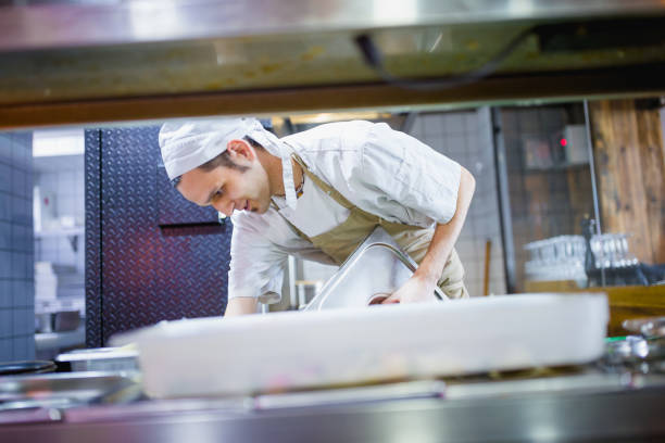 istock Chef cooking in the modern kitchen in a high-end restaurant 1158191295