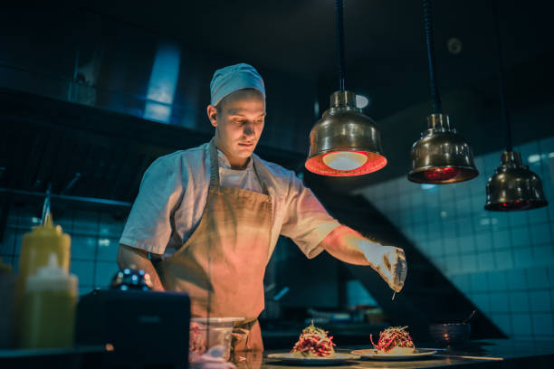 istock Chef cooking in the modern kitchen in a high-end restaurant 1158191299
