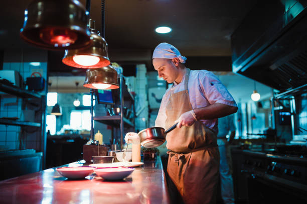 istock Chef cooking in the modern kitchen in a high-end restaurant 1158191301
