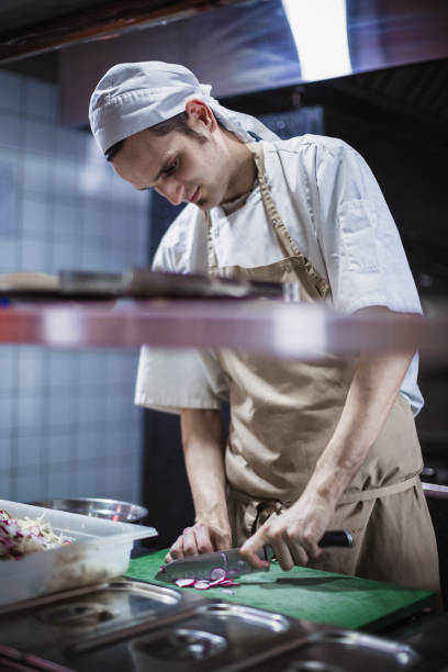 istock Chef cooking in the modern kitchen in a high-end restaurant 1158191302