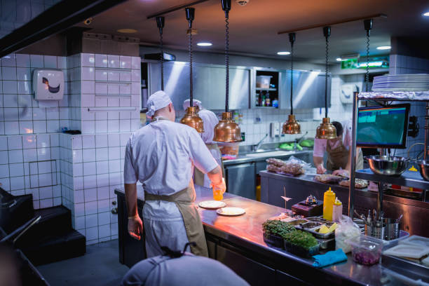 istock Chef cooking in the modern kitchen in a high-end restaurant 1158191303