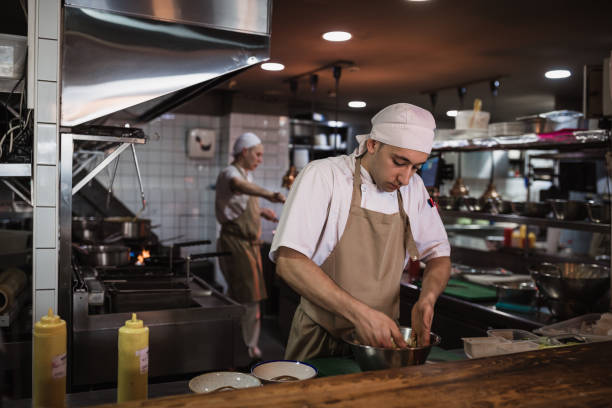 istock Chef cooking in the modern kitchen in a high-end restaurant 1158191314