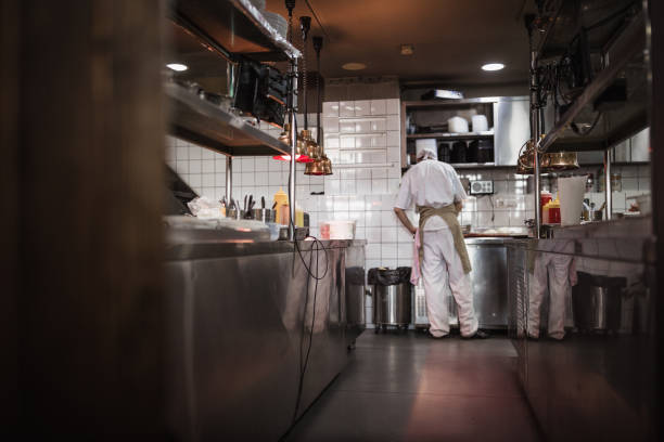 istock Chef cooking in the modern kitchen in a high-end restaurant 1158191330