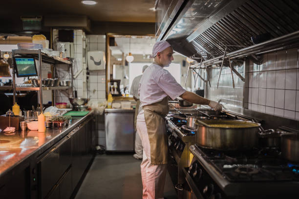 istock Chef cooking in the modern kitchen in a high-end restaurant 1158191333