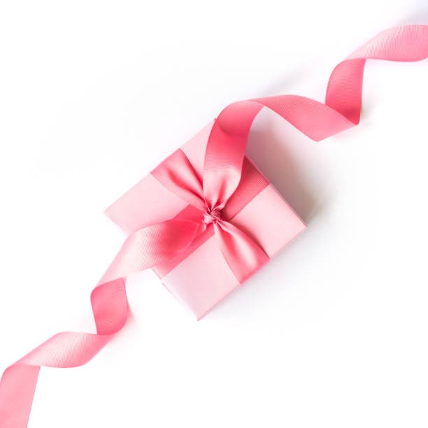 istock Pink gift box with a pink ribbon on a white background . 1158191384